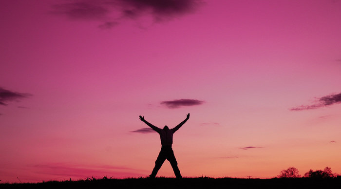 Scaled_man-enjoying-freedom-pink-sky-pictures