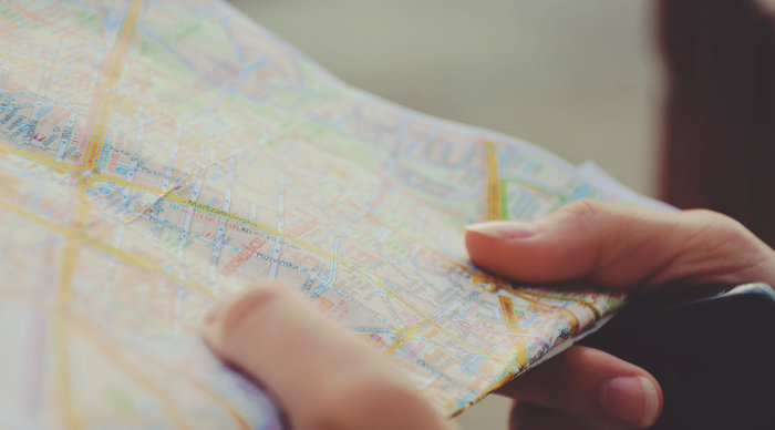 Scaled_hands-way-guide-tourist